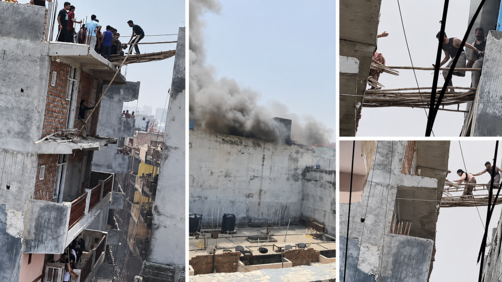 Mamura incident showing smoke rising from a building as people gather on the rooftop